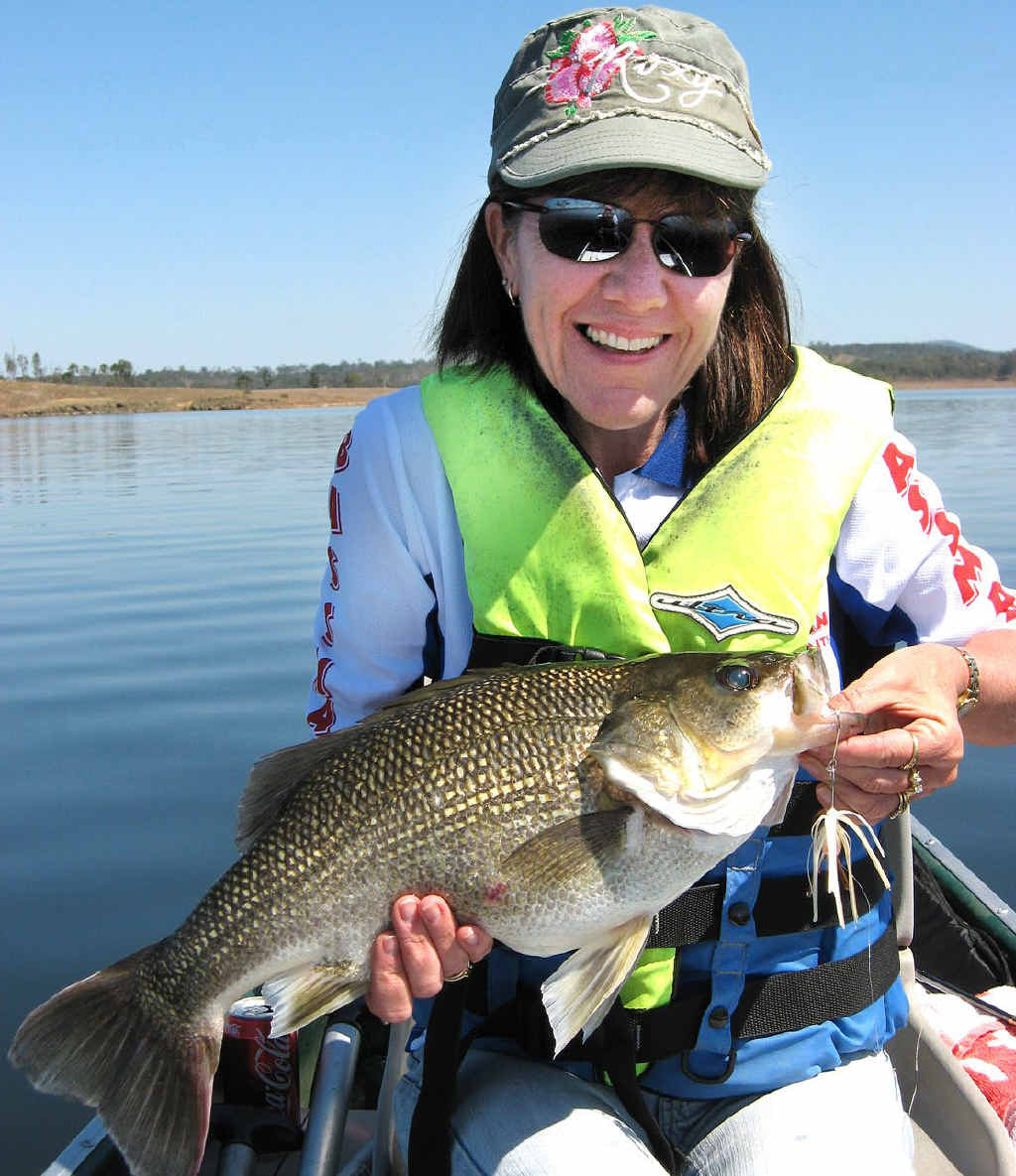 PLEASING EFFORT: Sue Casey is all smiles after catching a big Wivenhoe Dam bass. PLEASING EFFORT: Sue Casey is all smiles after catching a big Wivenhoe Dam bass.